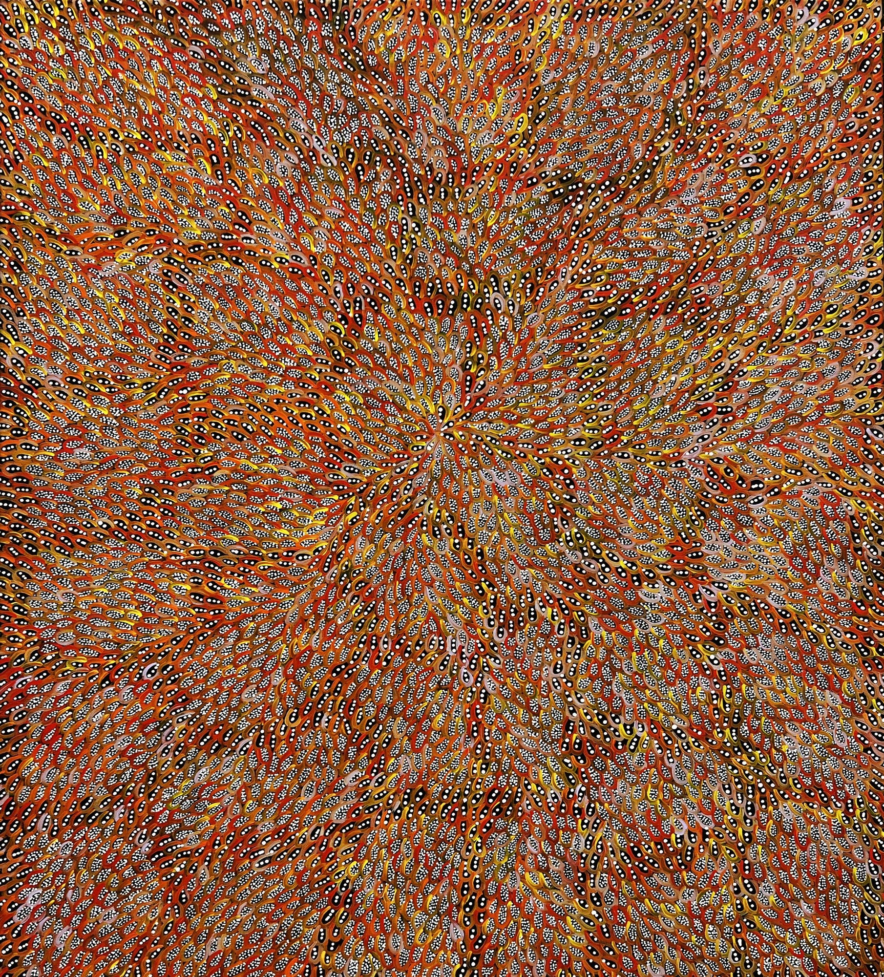 A large painting of thousands of small dotted leaf shapes radiating outward from a central point in orange, ochre, yellow and white on a warm red ground.