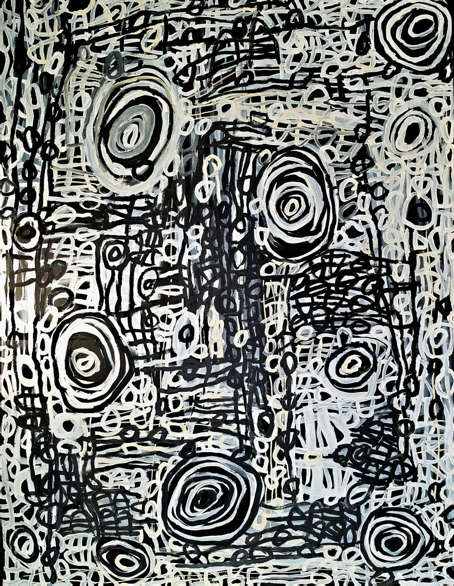 Black and white abstract painting of concentric circles and fine linework depicting women's body paint designs, by Charmaine Pwerle.