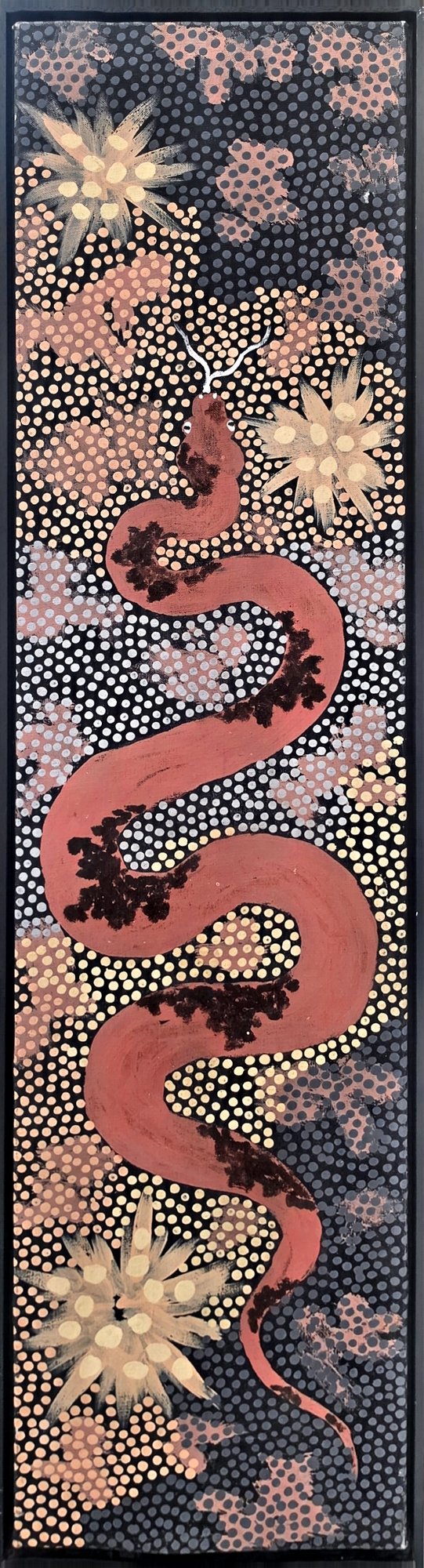Tall vertical painting of a red carpet snake with dark markings winding down a field of fine dot work in cream, pink and charcoal, with pale ochre star flowers in the corners.